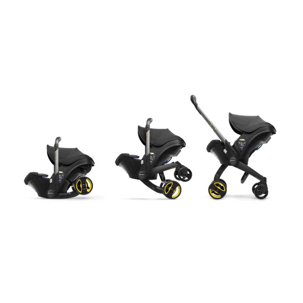 Doona+ Baby Car Seat & Travel Stroller - Convertible Infant Car Seat, Carry Cot and Pram with 5 Point Safety Harness, Ergonomic Pushchair and Travel System (ISOFIX Base Sold Separately)- black