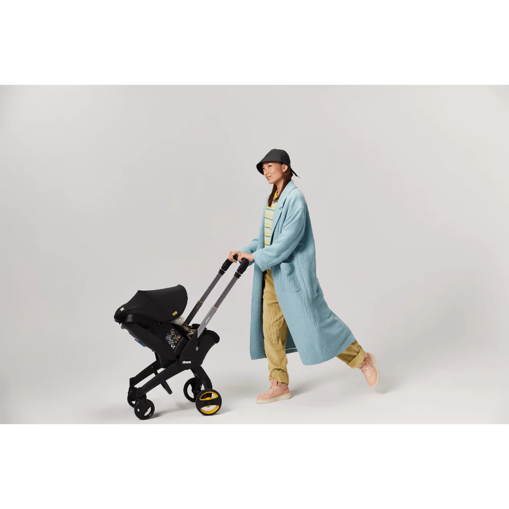 Doona+ Baby Car Seat & Travel Stroller - Convertible Infant Car Seat, Carry Cot and Pram with 5 Point Safety Harness, Ergonomic Pushchair and Travel System (ISOFIX Base Sold Separately)- black