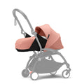 Stokke YOYO³ 0 Months+ Newborn Pack – Flat Lying Newborn Seat with 2.4cm Mattress, Head Support, 5-Point Safety Harness, Foot Cover & Canopy - Requires YOYO Frame Ginger